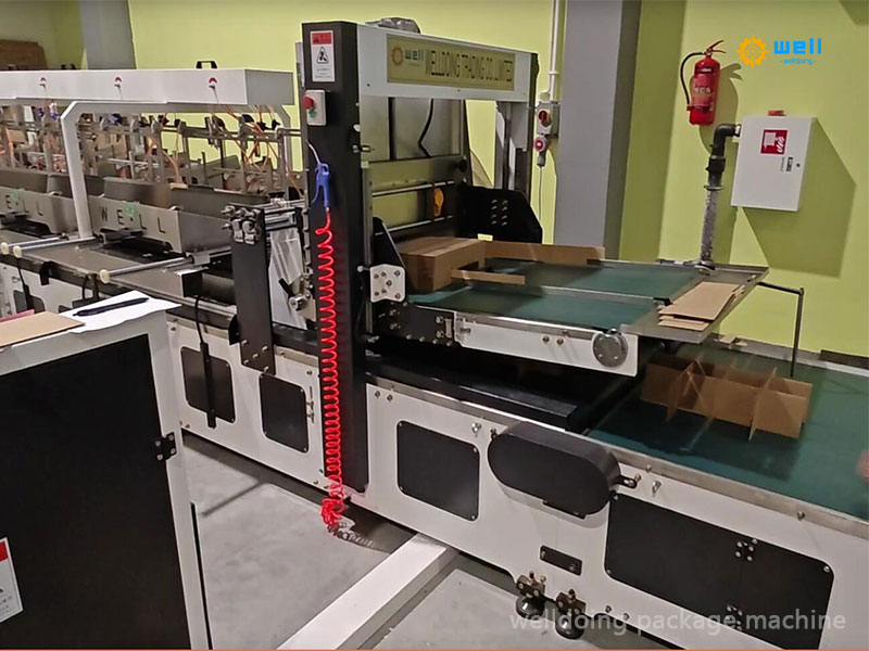 Machine adjustment of the cardboard box partition assembler machine