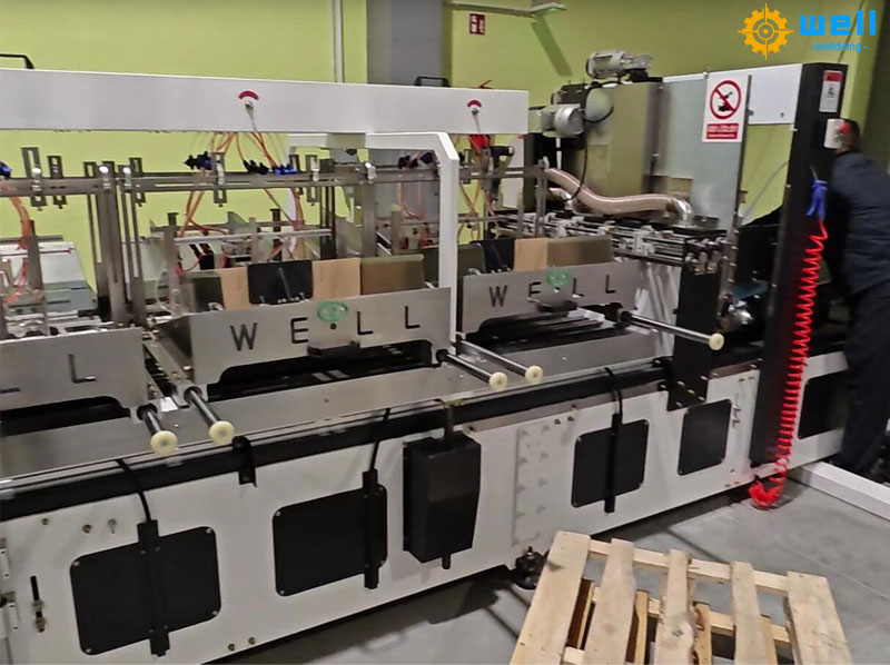 Components of a fully automatic cardboard partition assembler machine